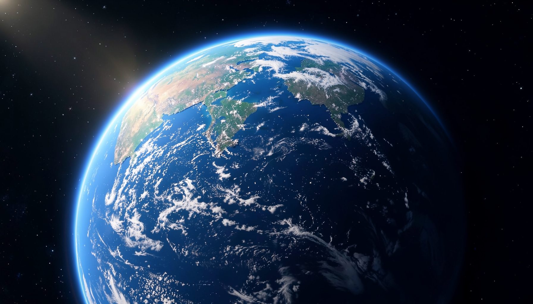 View of Earth from space showing blue oceans, clouds, and continents against a starry black background
