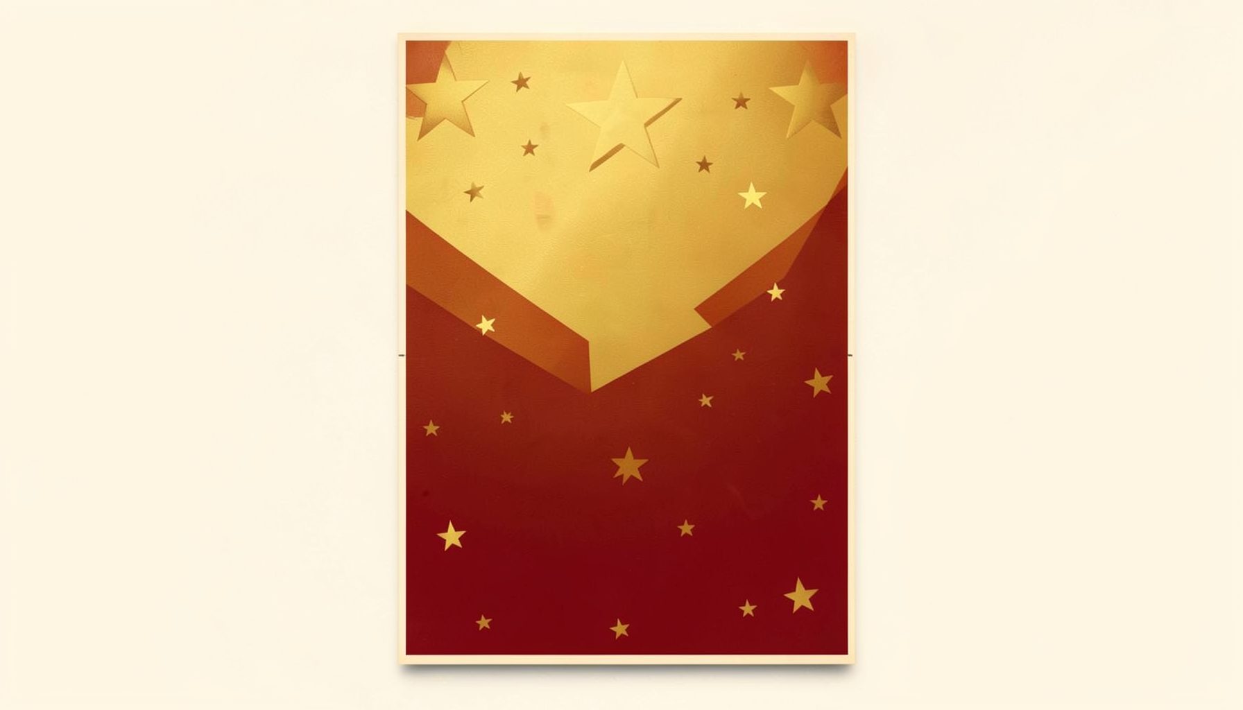 Abstract graphic poster with gold stars on a red and gold background, framed on a cream wall